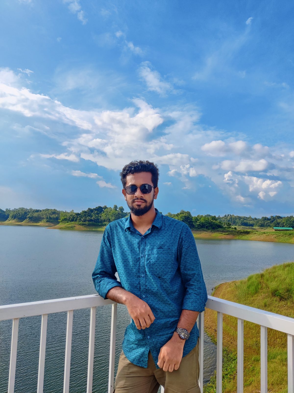Mehedi Hasan Foysal standing at a lakeside railing